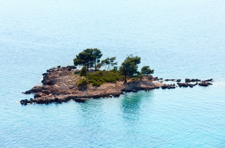 The small rocky island with few trees near Adriatic Sea coast (Croatia)の写真素材