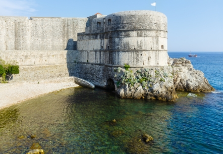 Summer fortress view,  Lovrijenac tower on rock and clear water of Adriatic Sea (Dubrovnik Town, Croatia)の写真素材