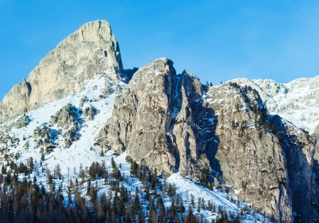 Beautiful winter mountain landscape with fir forest on slope (Falzarego Pass , Italy).の写真素材