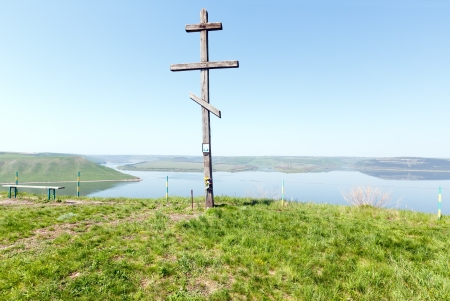 Wooden Cross and Bakota spring morning haze view   Khmelnytskyi Oblast, Ukraine の写真素材