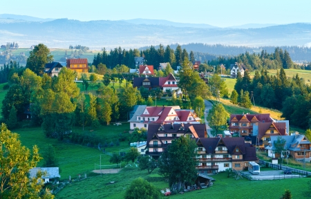 Summer morning hazy mountain village view  (Gliczarow Gorny, Poland)の写真素材