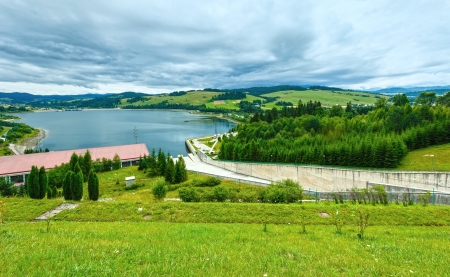 Summer cloudy country view and lake Czorsztyn, Poland.の写真素材