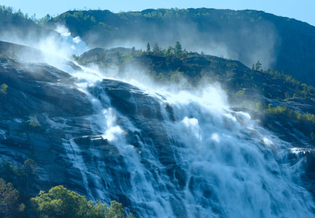 Summer mountain  Langfossen waterfall on slope  Etne, Norway  