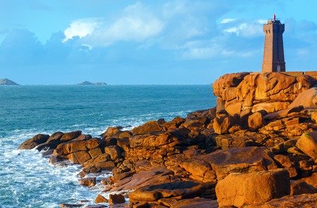 Ploumanach lighthouse sunset view (Perros-Guirec, Brittany, France). The Pink Granite Coast.の写真素材