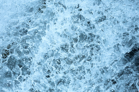 Bubbling stream of water closeup (nature background).の写真素材