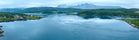 Fjord summer night view from bridge with flowing water (Norway)