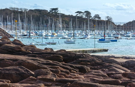 Bay with sailboats. The Cote de granite rose (or Pink Granite Coast) in Brittany, France. Spring view.の写真素材