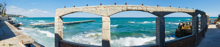 Sea storm and ruined pier (Black Sea, Bulgaria, near Varna). Panorama.の写真素材