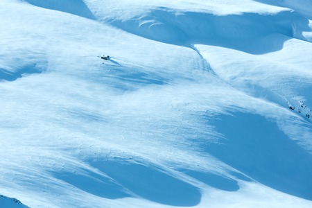 Small wooden house on winter mountain slope.の写真素材