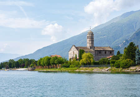 Lake Como (Italy) shore summer view with church from ship boardの写真素材