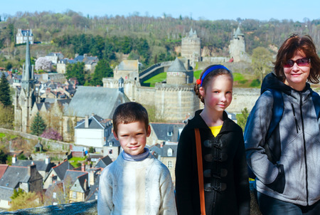 Family on spring holidays in France. Behind Chateau de Fougeres (build in XII-XV centuri).の写真素材