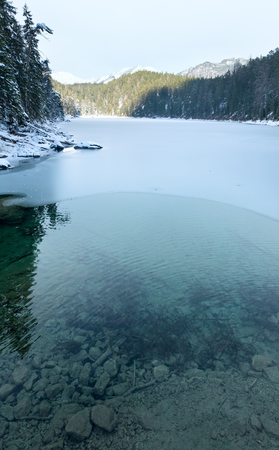 Untersee lake winter view with thin layer of ice on the surface, Bavaria, Germany.