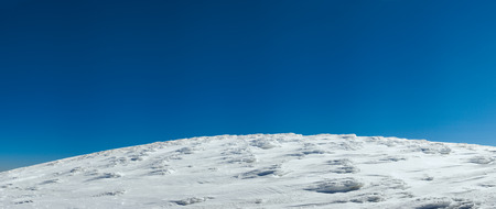 Mountain top panorama view on blue sky backgroundの写真素材