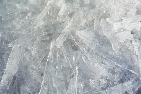 Glacial block of ice with interesting structure crystals macro. Winter background.