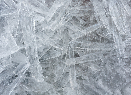 Many elongated pieces of ice closeup. Winter background.