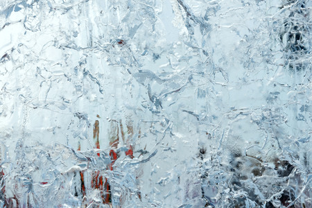 Glacial transparent wall of ice with interesting drawings and patterns . Closeup, background.の写真素材