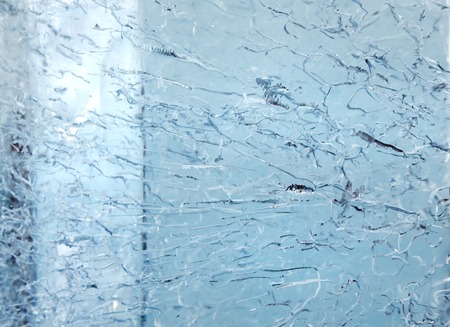 Glacial transparent wall of ice with interesting drawings and patterns . Closeup, background.の写真素材