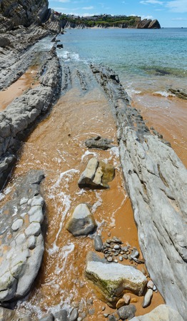Detail of bare rocks because of low tide at cbeach (Pielagos, Cantabria)