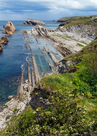 Atlantic ocean rocky coastline near Portio Beach, (Pielagos, Cantabria, Spain)