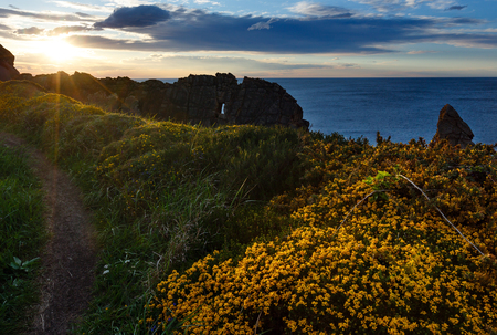 Sunset on blossoming Arnia Beach (Spain, Atlantic Ocean).の写真素材