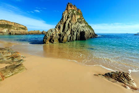 Sandy Mexota beach and pointed rock. Atlantic Ocean coastline landscape (Spain).の写真素材