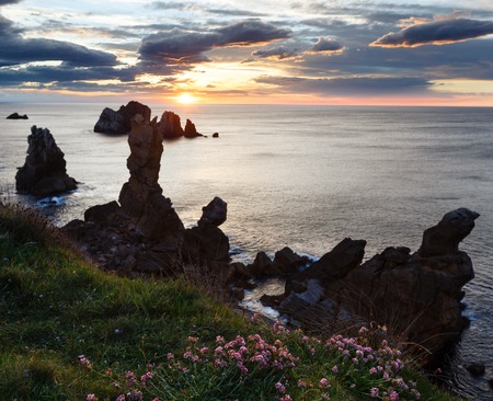 Sunset Arnia Beach (Spain, Atlantic Ocean) coastline landscape.の写真素材
