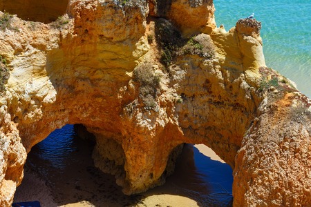 Rocks on sandy beach Dos Tres Irmaos(Portimao, Alvor, Algarve, Portugal).の写真素材