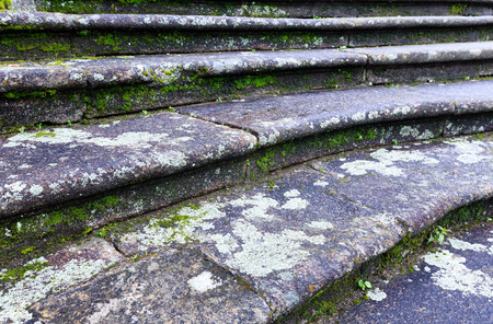 Old town stony  staircase (closeup) with green moss and lichen.の写真素材