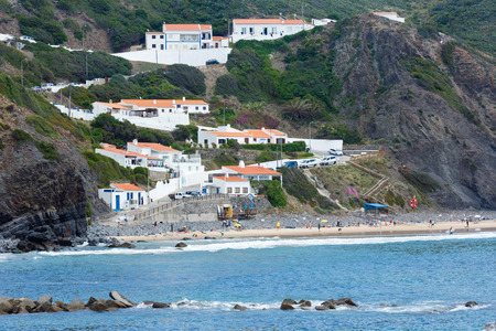 Aljezur, Portugal - MAY 23, 2016: Summer sandy Arrifana Beach with people.のeditorial素材