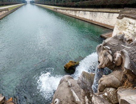 Caserta, Italy - January 10, 2015 :  Details of Dolphin fountain in Royal Palace garden in Caserta, Italy.のeditorial素材