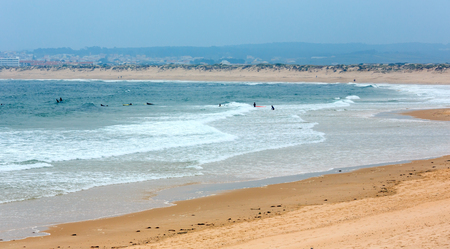 Sandy beach Praia Cova de Alfarroba (Peniche, Portugal). People unrecognizable.の写真素材