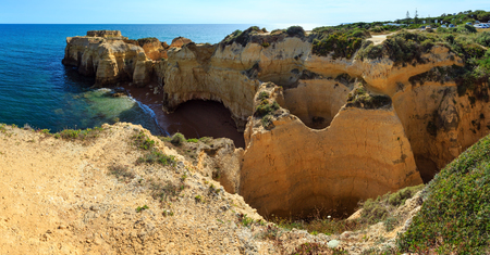 Summer Atlantic yellow rocky coast top view (Albufeira outskirts, Algarve, Portugal). Two shots stitch panorama.の写真素材