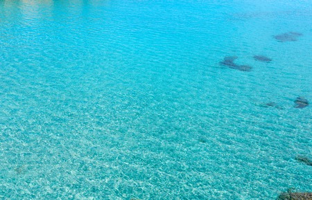 Aquamarine sea flowing water surface with waves and some bottom view. Abstract background pattern.の写真素材