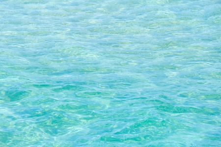 Aquamarine sea flowing water surface with waves and some bottom view. Abstract background pattern.の写真素材