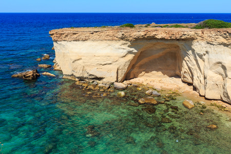 Grottoes on Spiaggia Massolivieri beach. Summer sea landscape (Siracusa, Sicily, Italy)の写真素材