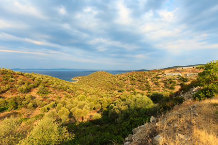 Early morning on Sithonia (Greece) and sky with dark clouds.の写真素材