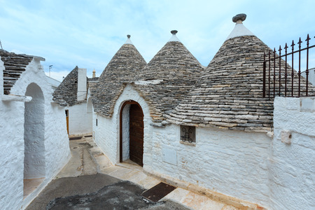 Trulli houses in main touristic district of Alberobello beautiful old historic town, Apulia region, Southern Italyの写真素材