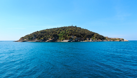 Beautiful rocky sea coast of Tino island (with lighthouse and monastery ruins) near Portovenere (Gulf of Poets, Cinque Terre National Park, La Spezia, Liguria, Italy).の写真素材
