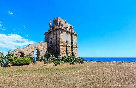Picturesque historical fortification tower Torre Colimena on Salento Ionian sea coast, Taranto, Puglia, Italyのeditorial素材