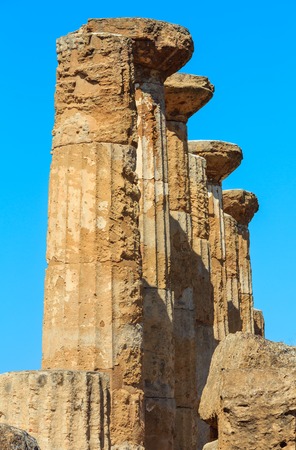 Ruined Temple of Heracles columns in famous ancient Valley of Temples, Agrigento, Sicily, Italy.の写真素材