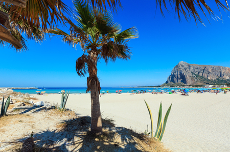 Paradise Tyrrhenian sea bay, San Vito lo Capo beach with clear azure water and extremally white sand, and Monte Monaco in far, Sicily, Italy. People unrecognizable.の写真素材