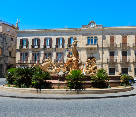Diana fountain (installed by Giulio Moschetti  in 1907) in the center of Siracusa - piazza Archimede. Ortigia island at city of Syracuse, Sicily, Italy. Beautiful travel photo of Sicily.のeditorial素材