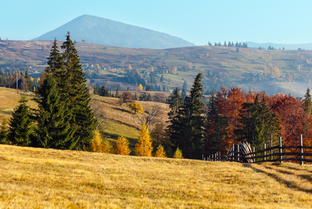 Morning fog on the slopes of the Carpathian Mountains (Yablunytsia village, Ivano-Frankivsk oblast, Ukraine). Autumn rural landscape.の写真素材