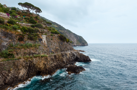 Beautiful summer Riomaggiore outskirts - one of five famous villages of Cinque Terre National Park in Liguria, Italy, suspended between Ligurian sea and land on sheer cliffs.の写真素材