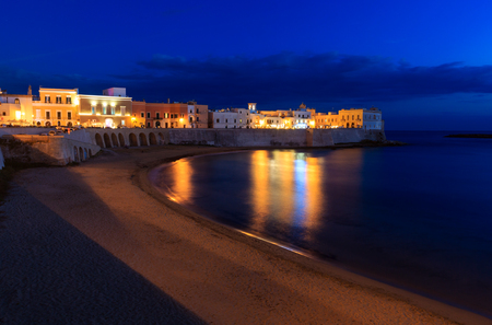 Evening dusk in Gallipoli, province of Lecce, Puglia, southern Italy.  View from walls of Angevine-Aragonese medieval Castle fortressの写真素材