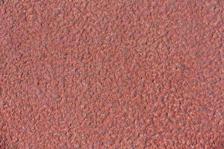 Macro red stucco wall fragment texture pattern background.の写真素材