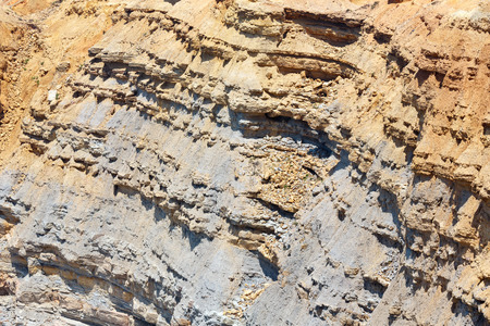 Orange soil rock surface with stony-clay texture. Atlantic rocky coast (Costa Vicentina, Algarve, Portugal).の写真素材