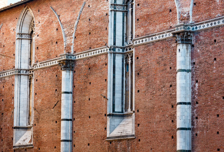 Summer Siena Italian medieval town street scene, Siena province, Tuscany, Italy.の写真素材