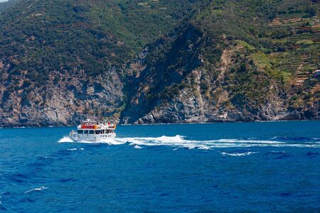 VERNAZZA, ITALY - JUNE 26, 2017: Beautiful summer view from excursion ship. One of five famous villages of Cinque Terre National Park in Liguria.のeditorial素材