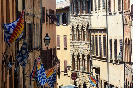 VOLTERRA, ITALY - JUNE 24, 2017: Summer ancient walled mountaintop town Volterra street scene, Pisa province, Tuscany, Italy.のeditorial素材